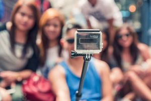 People Taking Picture With GoPro Selfie Stick Camera